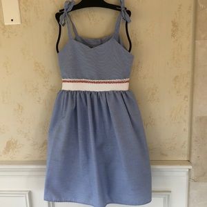 Beautiful girls summer dress. Adjustable straps and ties in the back.